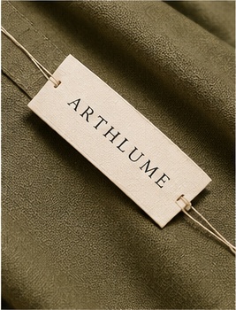 Arthlume clothing label on olive fabric